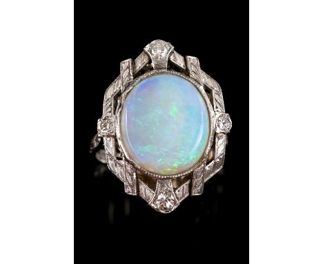 Opal and diamond dress ring, central oval cabochon cut opal, 13 x 11mm, surrounded by compass set round brilliant cut diamond