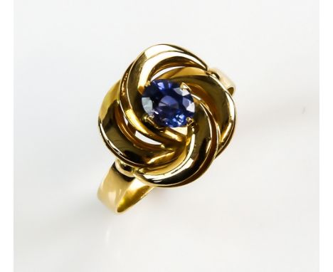 Vintage dress ring set with a single faceted sapphire in a gold twist mount, 18 ct gold, ring size O .   sapphire 6 x 4.5 mm.