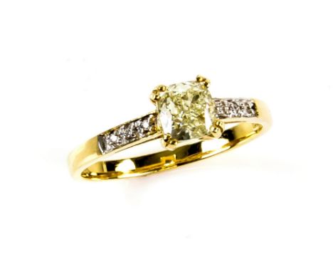 Fancy coloured diamond ring, central yellow cushion cut diamond, shoulders set with eight round brilliant cut diamonds, estim