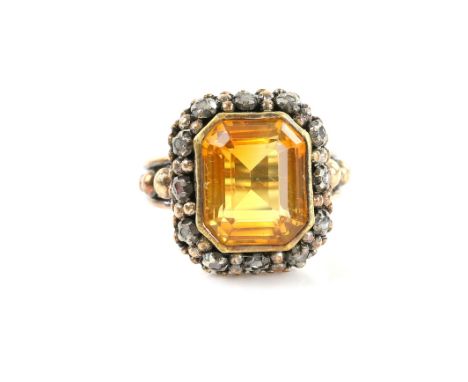 Dress ring, central step cut citrine, set within a border of rose cut diamonds, bearing Portuguese marks for gold and silver,