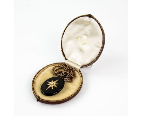 Victorian mourning pendant, central seed pearl star motif, reverse hair locket panel, black enamel articulated bail, 5.7 x 3.