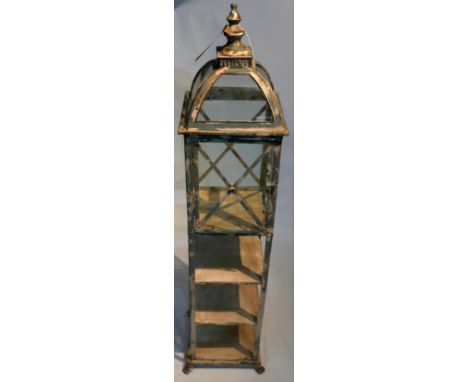 A Regency style etagere storm lantern with open shelves raised on lions paw supports, H.130cm 