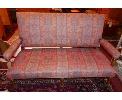 A Victorian Aesthetic hall bench, upholstered in a floral decorated fabric, raised on turned legs, H.106 W.164 D.68cm 