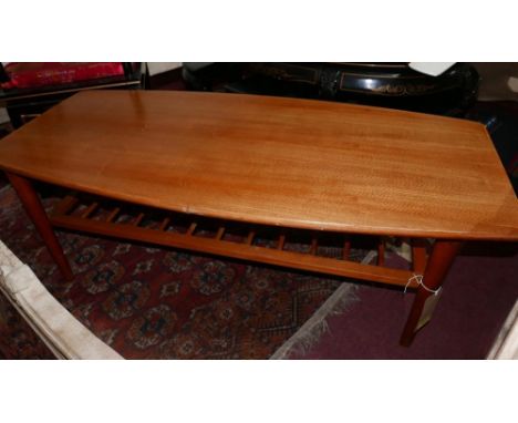 A 1960's G Plan teak low table, with spindled under tier shelf, H.45cm L.120cm W.55cm 