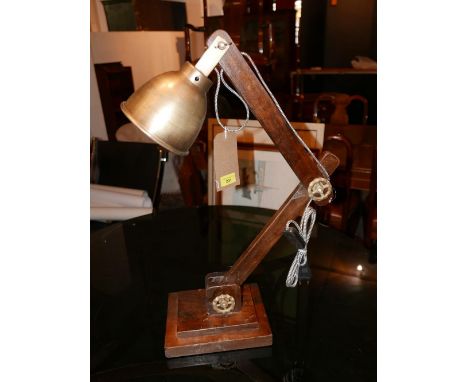 A nautical inspired adjustable wooden desk lamp with brass shade, approx. H.80cm 