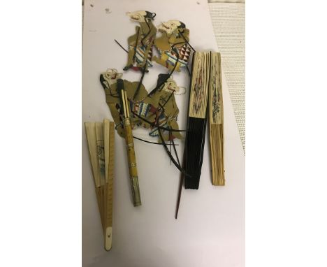 A quantity of Oriental fans and puppets; together with a chopstick holder