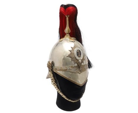 An 1871 pattern helmet, the brass body with nickel finish with laurel band to the front and back, tall four sided spike with 