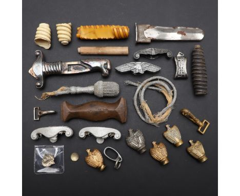 An interesting collection of dagger parts including an RAD Leader's grip, five Kriegsmarine Officers' dagger pommels, centre 