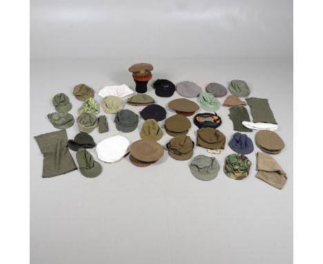 A Royal Marines type knitted hat stamped with government arrow 'Leek' 1943'. Camouflage cap dated 1958, A U.S. Army Herringbo