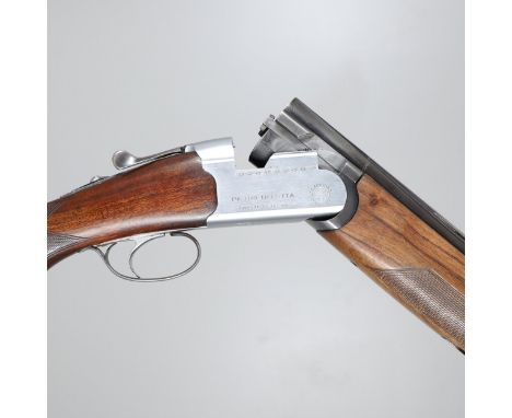 A 12 bore shotgun by Pietro Beretta of Italy with 71 cm over and under barrels. All parts numbered 165747, and various other 