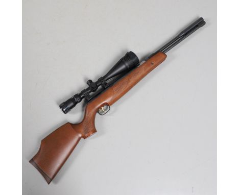 A Weihrauch HW 97K .22 air rifle number 1892976. With button release under-barrel lever cocking, walnut stock with semi pisto