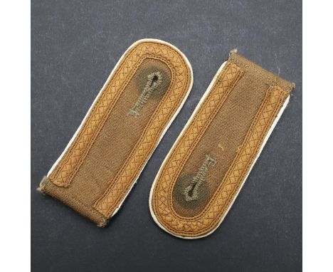 A pair of Afrikakorps Infantry NCO's shoulder straps, pale sand colour with fieldgrey undersides, white piping and light brow