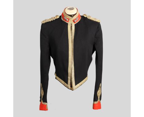 A black mess jacket with red cuffs and collar and gold braid front, the collar with twin bullion flaming grenade badges, the 