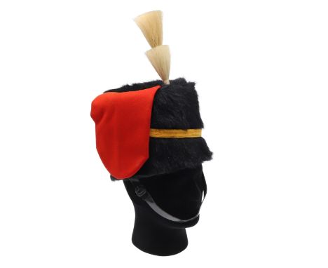 A Royal Horse Artillery busby with stepped plume, woven fabric yellow band, red side bag and leather chin strap. With leather