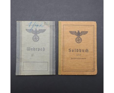 A 'Soldbuch' identity card with brown cover with large black eagle emblem, in unissued condition with all pages, with two pho