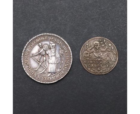 A small medal with a skeletal figure with a scythe, standing by another in robes holding a clock and sun, within the legend '
