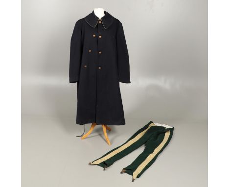 A black double-breasted overcoat by Jones Chalk &amp; Dawson Ltd of 5 Sackville Street Piccadilly. With broad cream backed co