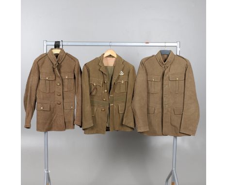 Three uniform jackets with four pocket fronts. Two 1922 pattern jackets with General Service buttons, one with remains of pap