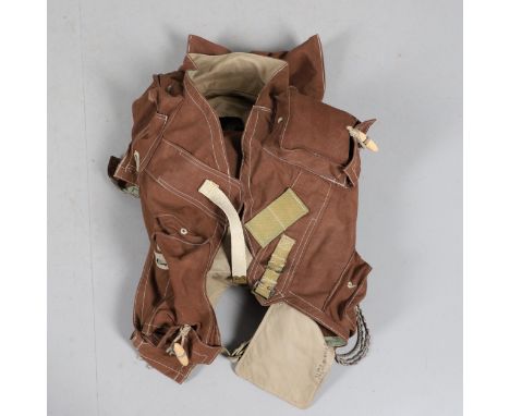 A replica set of webbing or back pack with a large central back pocket and various other pockets and fixings with cord and to