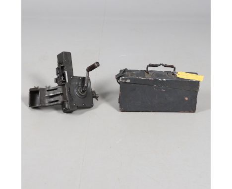 A machine gun belt loading tool stamped G57n-60 WA with winding handle and bullet feeder. In a carrying case. And another sim