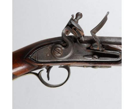 With a 94cm tapering barrel with proof marks and decoration by the action, with ramrod below the barrel. The Flintlock action