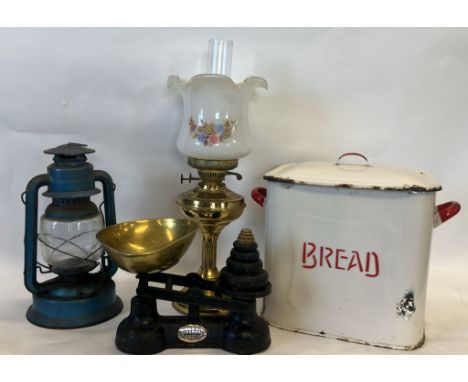 An enamel bread bin and cover, height 31cm together with a brass oil lamp, a Chalwyn Tempest paraffin lamp and a set of The S