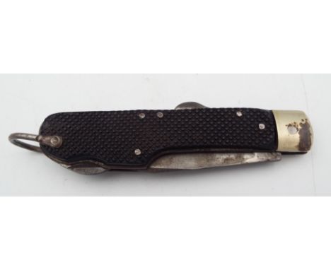 A WWII Special Operations Executive folding knife with tyre slashing blade, black chequered bakelite handle, folded length 12