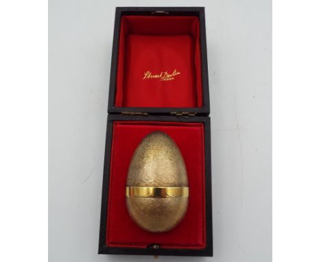 A Stuart Devlin silver, silver gilt and enamel surprise Easter egg with a juggling clown and dog, numbered 190, height 7cm an