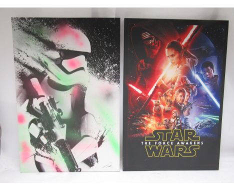 A Star Wars 'The Force Awakens' canvas print and another depicting a Stormtrooper with later applied flourescent green and pi