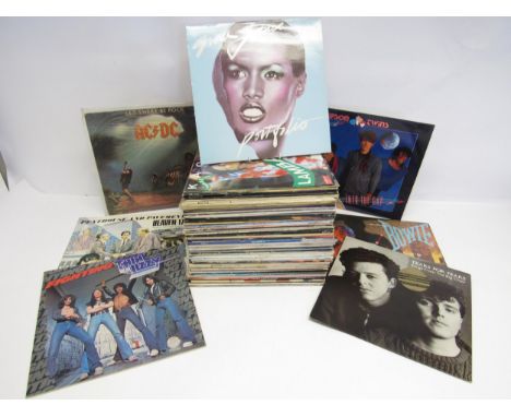 A collection of predominantly 1980s Rock and Pop LPs and 12" singles including Heaven 17, Grace Jones, David Bowie, INXS, Ste