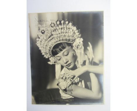 Anna May Wong (Chinese American actress 1905-1961) - A signed black and white photograph of Wong Liu-Tsong, known professiona