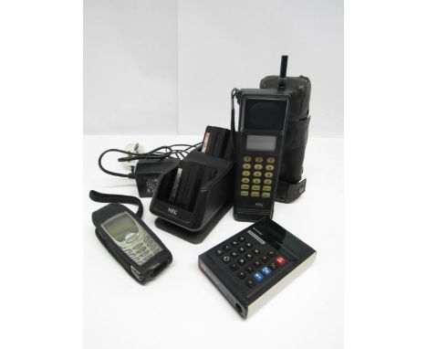 A 1980s NEC TR5E1320-9A portable brickphone with desk charger and batteries, a Nokia 6310i mobile phone and a Sharp EL-8100 e