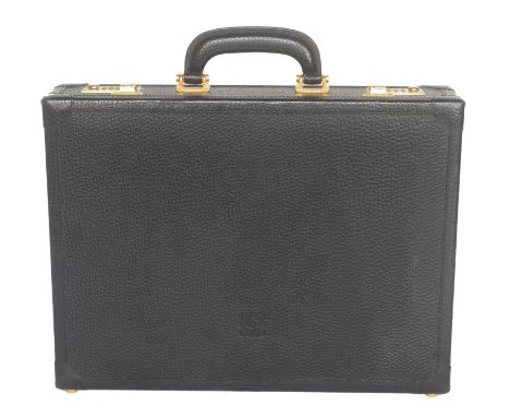A Loewe briefcase, the black leather exterior with embossed maker's logo to front, gold-tone hardware, combination lock faste