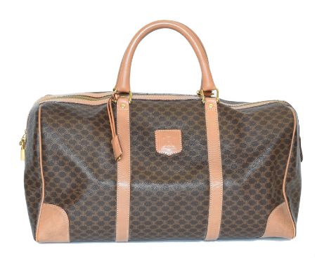 A Celine Vintage Boston Travel Bag, the maker's Macadam canvas exterior with smooth leather trim and handles, and gold tone h