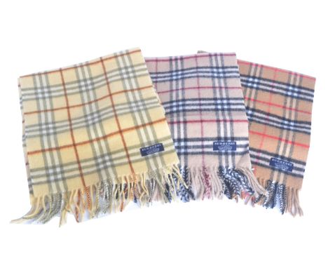 Three Burberry wool scarves, in the maker's nova check, two 100% lambswool, one 100% cashmere (3).Condition report: Overall c