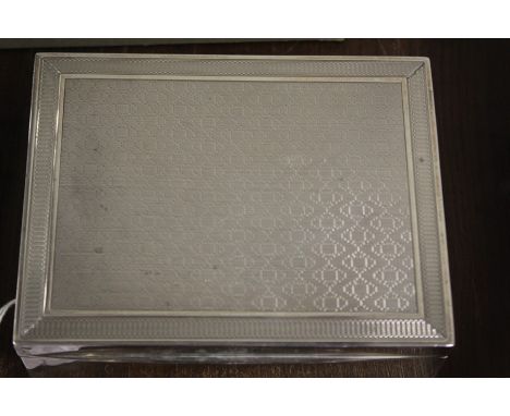 George V silver cigarette box, Birmingham 1928, maker Henry Matthews, the lid with engine turned decoration, 12cm wide