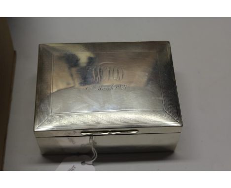 George V silver cigarette box, marks rubbed, the engine turned lis with initials WMD and dated 18th March 1920, 11.5cm wide