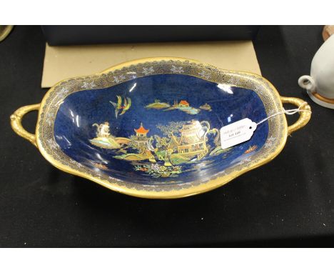 Carlton ware oval twin handled dish, the blue mottled ground with Oriental landscape decoration and gilt borders, 33.5cm wide