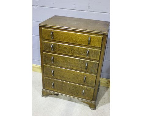 Early 20th Century oak chest of drawers, the top with an open gallery, above five drawers, raised on bracket feet, 74cm wide,