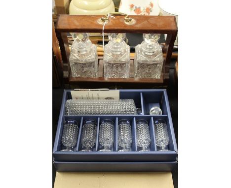 20th Century mahogany tantalus, containing three square decanters, Krosno decanter and six glasses, housed in original box (2