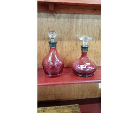 2 ANTIQUE RUBY GLASS DECANTERS WITH SILVER COLLARS 