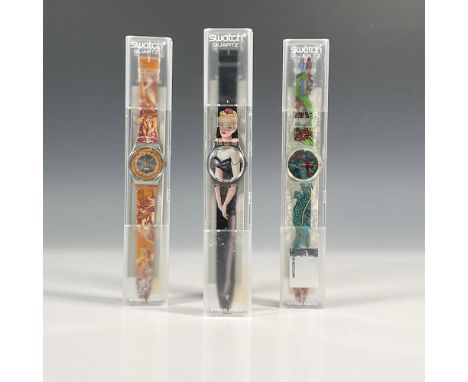 Three Swatch watches in quartz movement, all in original hard plastic cases with folded information sheeting including Lolita