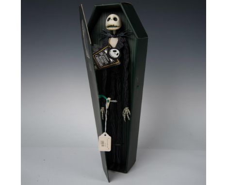 Encased in a mysterious dark green coffin with a peering window, this figure features Jack Skellington in his classic black a