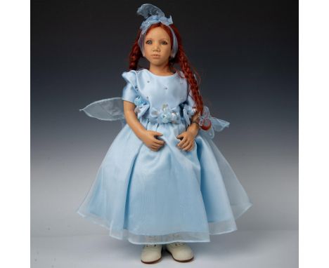 Tall resin doll with lifelike features and expression. Marlie has bright red hair and wears a blue dress with pearlized bead 