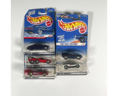 A set of 5 Hot Wheels toy cars that consists of the Jaguar D-Type (6 of 48), the Chaparral 2 (28 of 40), the Tail Dragger (24