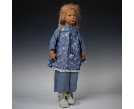New in original packaging. Light brown hair with same colored eyes. Dressed in blue cotton shirt and pants decorated with flo