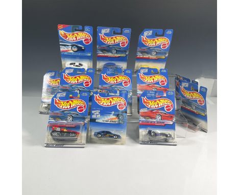 A set of 12 Hot Wheels cars which includes Treadator (Collector #941), the Alien (Collector #729), the Jaguar XJ220 (Collecto