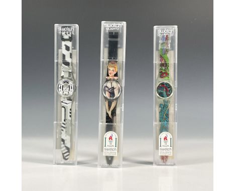 Three Swatch watches in quartz movement, all in original hard plastic cases with folded information sheets including Lolita G