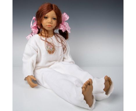 Tall resin doll with lifelike features and expression. Madina has auburn red hair and wears white knit pants and sweater with