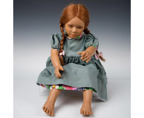 Tall resin doll with lifelike features and expression. Adrienne is barefoot, has red hair and wears a teal dress with floral 